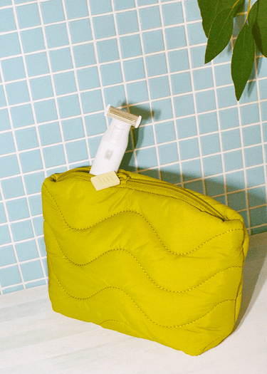 Fur chartreuse quilted dopp kit with Fur Trimmer.